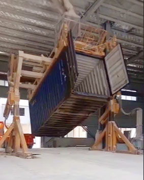 Container tilter loading cargo at customer's factory