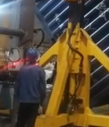 Workers are operating the Container tilter to unload cargo